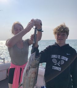 Two people fishing in Oswego