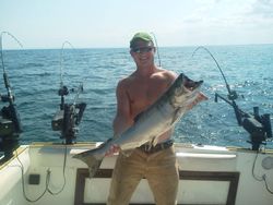A lone angler reeling in a 25-inch catch in New York