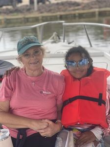 Two people enjoying a fishing cruise on the Mississippi River