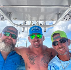 Three people enjoying a fishing cruise in FL