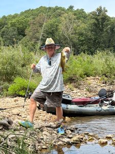 Two people fishing at Dora