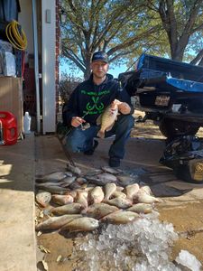 Angler with a 12-inch fish in TX