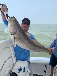 Angler with fishing rod in Galveston
