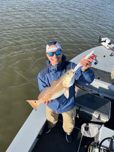 Angler holding fishing rod in TX