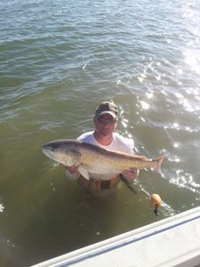 Angler with fishing rod enjoying the outdoors in TX