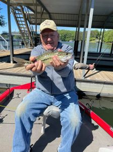 A fisherman holding a 16-inch fish in GA