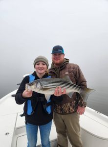 Hard-fighting striper in the net! 