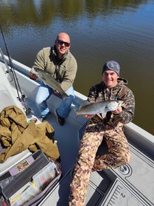 Two spotted weakfish and striped bass caught in New Bern, North Carolina