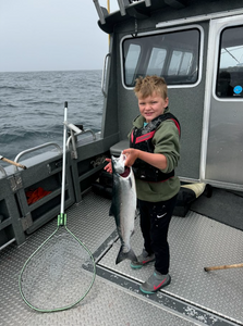 Fisherman holding a Spanish Mackerel in OR