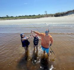 Three people fishing at North Myrtle Beach
