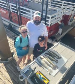 Fishing charter success with multiple fish displayed on boat deck in North Myrtle Beach SC