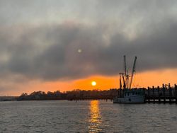 Fishing boat docked at marina during sunset in North Myrtle Beach SC