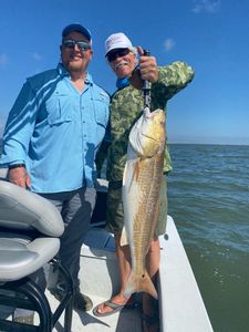 Two people fishing with a 28-inch catch in Corpus Christi