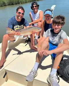 4 people fishing in Charleston