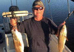 Two fishing rods with a scenic location in SC