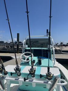 Fishing boat with multiple rod holders and reels at Port Aransas TX marina