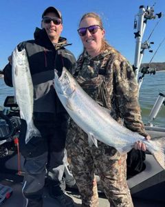 Two people fishing for 2 big fish in NY