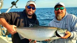 Two anglers reeling in a big catch in New York