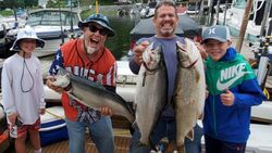 Three Chinook salmon caught by four people fishing in Sodus Point