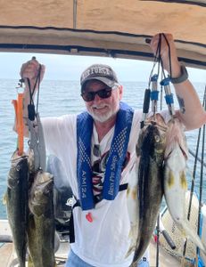 4 caught fish from a fishing trip in NY
