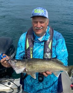 Fisherman holding a 19-inch Walleye in NY