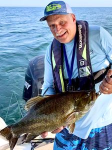 Fisherman holding a 16-inch catch in Buffalo