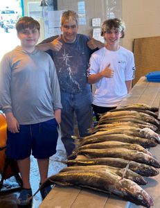 Two happy fishermen with big 29-inch catch in Buffalo
