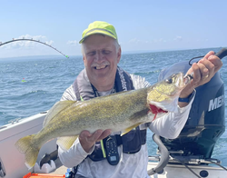 Angler holding a large walleye fish in New York