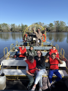 Airboat tour group on river in Orange TX with large fan propulsion system
