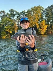Young angler had an awesome day catching this rainbow trout - Branson, MO.