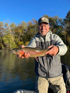 Angler with rainbow trout in MO