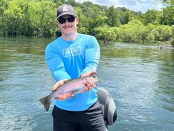 A single rainbow trout caught while fishing in Branson