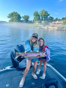 Angler holding a rainbow trout in MO
