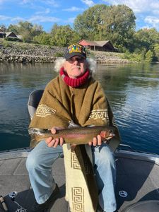 Anglers catching a rainbow trout in Missouri