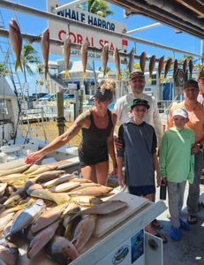 Anglers fishing in Islamorada, Florida with 2 big catches