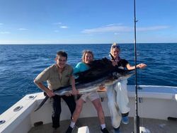 A group of 3 people fishing in Islamorada