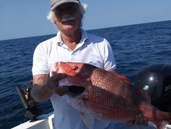 Angler fishing in FL with 1 fish