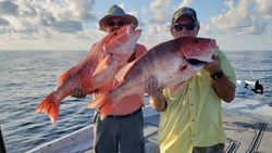 Two anglers holding their catch of two big fish in Alabama