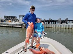 Anglers catching a big fish in Alabama