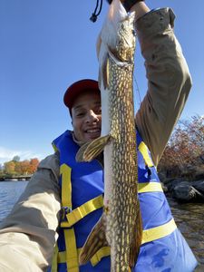 Angler with a large Northern Pike fish in Ottawa