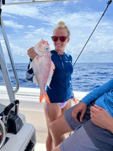 A single angler reeling in a catch in Florida