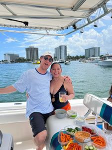 Two people enjoying a cruises and fishing in Pompano Beach