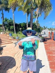 One fishing person catching a 23-inch fish in FL