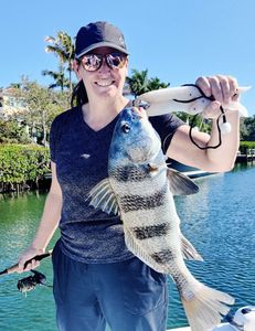 A fisherman with a black drum fish in FL