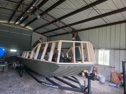 Boat under construction with wooden frame being built in workshop garage in Elma New York