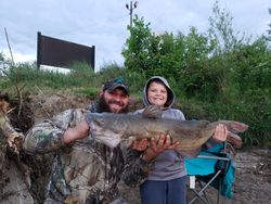 Large fish catch displayed outdoors in Elma New York fishing trip