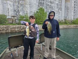 Two smallmouth bass caught while fishing in Elma New York displayed on boat