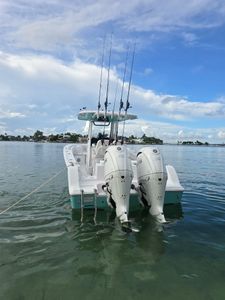 Two people on a boat enjoying a cruises and fishing trip in Key Biscayne