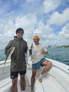 Two anglers with their catch during a fishing cruise in FL