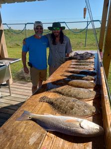 Two summer flounder and redfish caught while fishing in Texas City